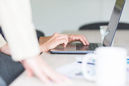 Hands Using Computer In Office Photo thumbnail