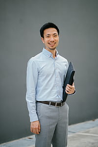 Man Holding Black Laptop Bag thumbnail