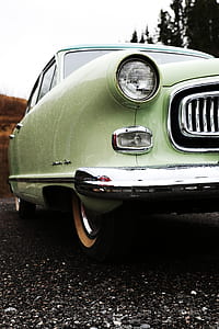 close-up photo of vintage green coupe thumbnail