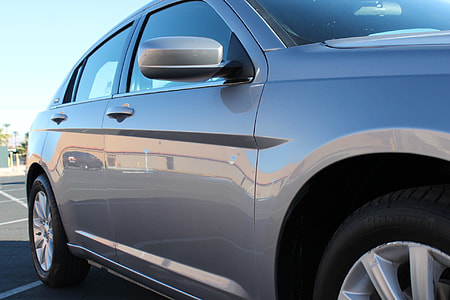 silver-colored sedan on parking space thumbnail