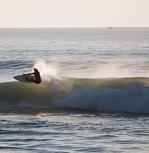 person surfboarding on sea waves thumbnail
