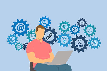 Illustration of man on laptop computer with social media network gear grinding away thumbnail
