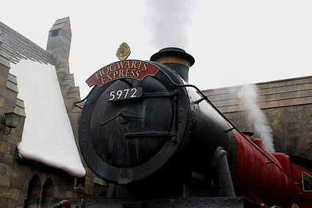 red and black train under white sky during daytime thumbnail