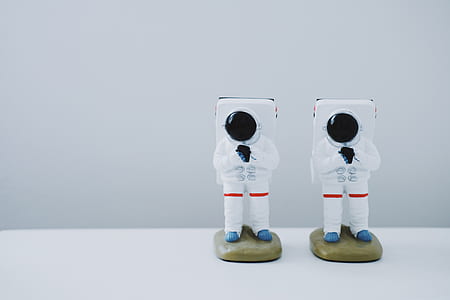two astronaut figurines thumbnail
