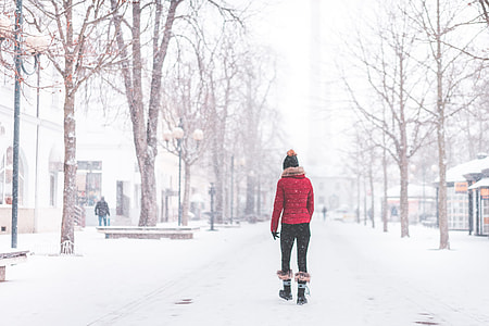 Young Woman Walking Alone in The Park in Snowy Weather thumbnail