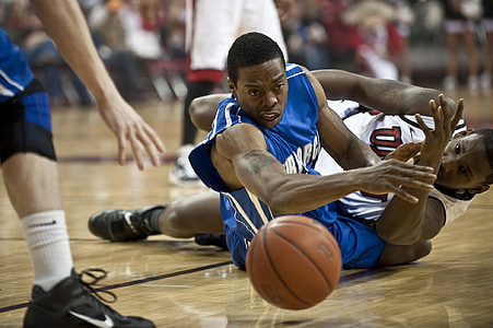 two basketball player on the ground looking at basketball thumbnail