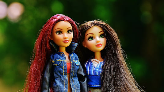 red haired and brown haired barbie doll photo thumbnail
