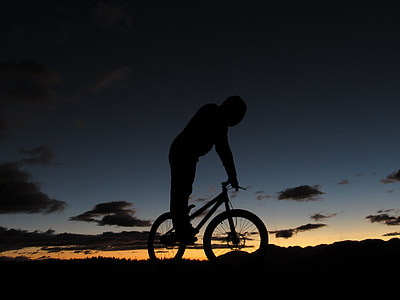 silhouette photography of man riding on bicycle thumbnail