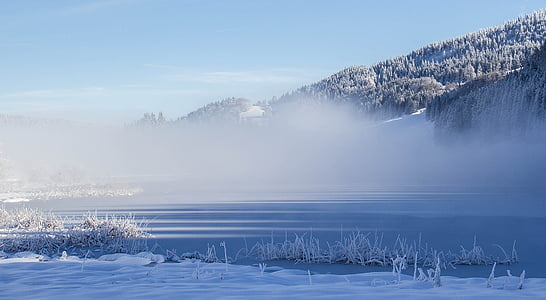 mountain near on body of water thumbnail