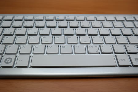 keyboard on brown table thumbnail