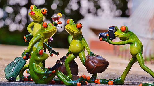shallow focus photography of four green frogs making a pose figurine thumbnail