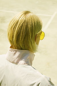 man standing while looking downward thumbnail