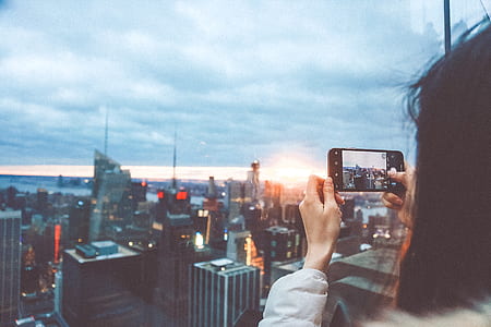 person taking photo of the city thumbnail