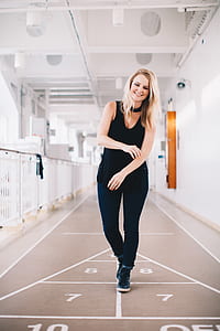 woman in black tank top and black pants playing hopscotch thumbnail