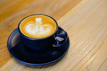 blue ceramic coffee cup filled with coffee thumbnail