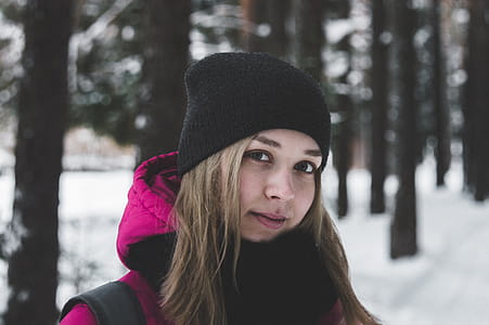 Woman in Pink and Black Jacket on White Snow thumbnail