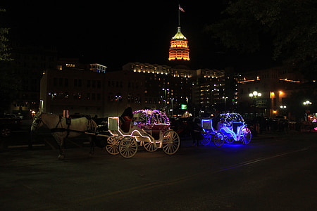 lighted carriage beside building thumbnail