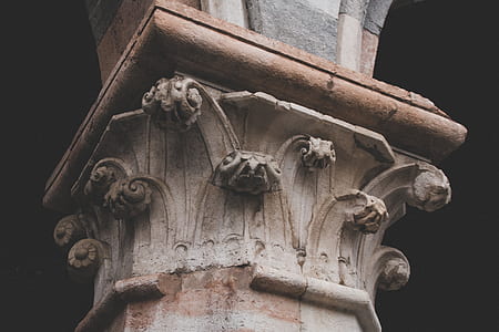 person taking photo of grey concrete column thumbnail