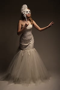 woman holding masquerade mask thumbnail