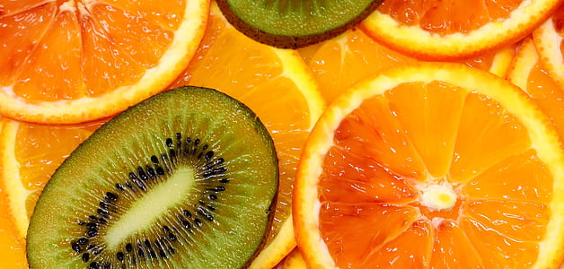 closeup photo of bunch of slices of oranges and kiwi thumbnail