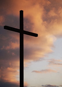 brown wood cross during golden hour thumbnail