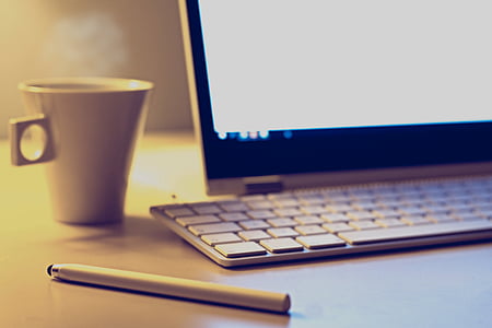 white pen near white ceramic mug thumbnail