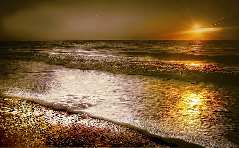 ocean wave during sunset photo thumbnail
