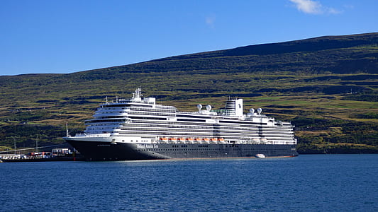 white cruise ship on body of water at daytime thumbnail