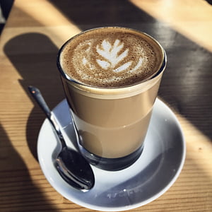 coffee latte in glass and on saucer thumbnail