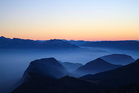 landscape photography of mountains covered with fog thumbnail