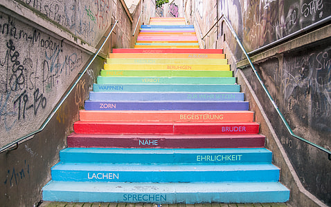 multicolored stairway with text and graffiti at daytime thumbnail