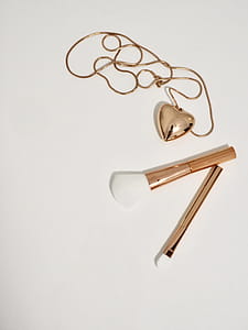 Photo of Gold Make-up Brushes and Necklace thumbnail