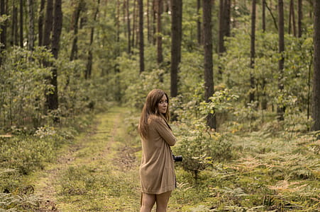 Woman Standing in the Middle of the Forest thumbnail