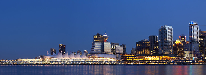 panoramic photography of high-rise buildings near body of water thumbnail