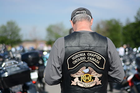 man in motorcycle jacket in selective focus photography thumbnail
