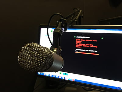 gray condenser microphone near flat screen monitor thumbnail