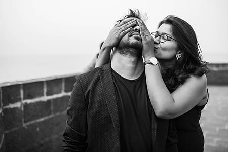 Grayscale Photography of Woman Covering Eyes of Man thumbnail