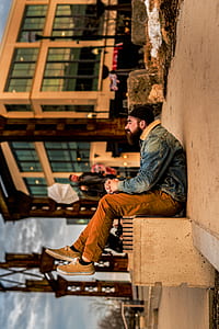 man wearing blue denim jacket thumbnail