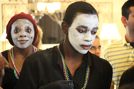 man with white paint on face thumbnail