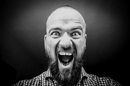 grayscale photo of man opening his mouth thumbnail