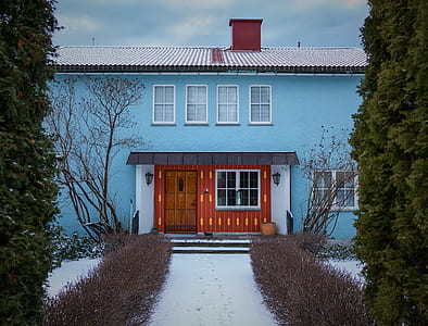 blue building with brown door thumbnail