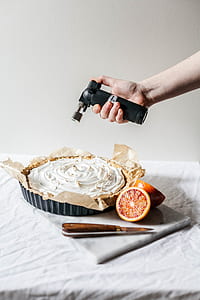 person using torch lighter on pie thumbnail
