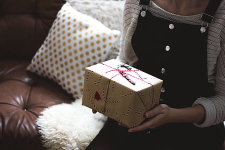 person holding gift box thumbnail