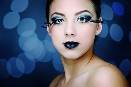 woman with blue eyeshadow and black lipstick thumbnail