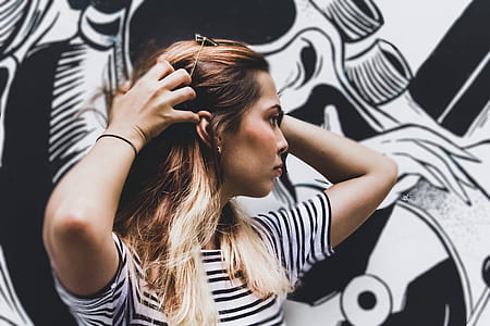 woman touching her hair thumbnail
