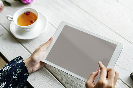 person using white tablet computer thumbnail