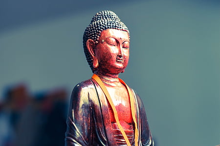 red and black Buddha figurine thumbnail