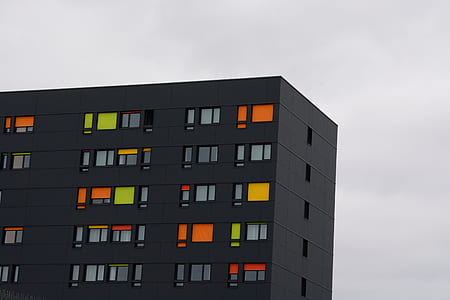 black painted building taken at cloudy morning thumbnail