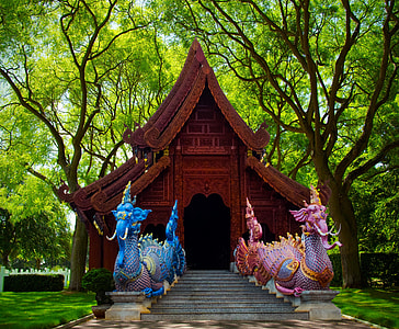 Chinese temple surrounded by green leaf trees thumbnail