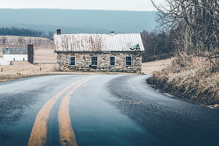 landscape photography of concrete bungalow near freeway thumbnail